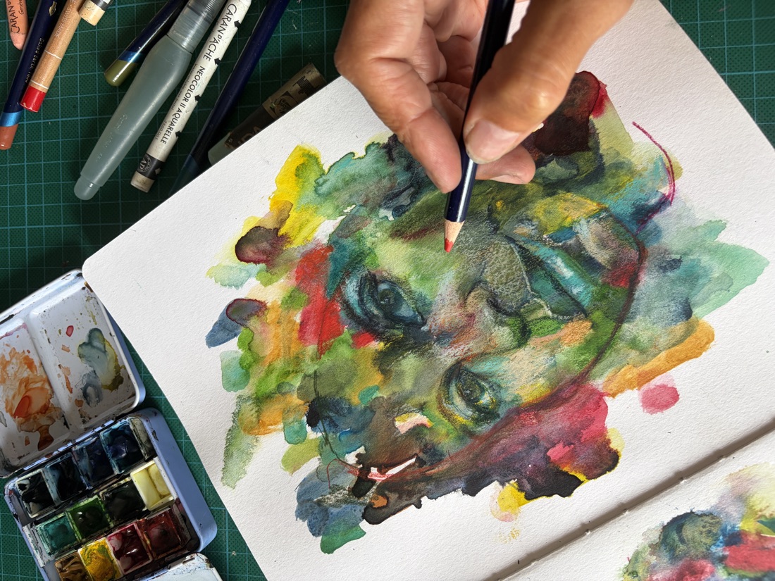 A colourful expressive portrait sketch in watercolour and pencil